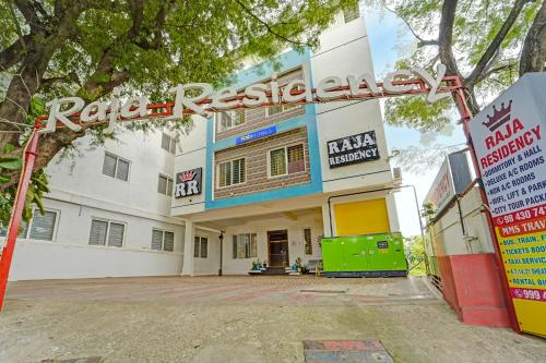 a building with a sign in front of it at FabHotel Raja Residency in Alāndurai