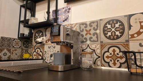 a kitchen counter with a coffee maker on top of it at Tatralandia Chatka Martius 434 in Liptovský Mikuláš