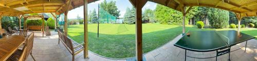 an estate with a table tennis court in the backyard at VITA Augustów in Augustów