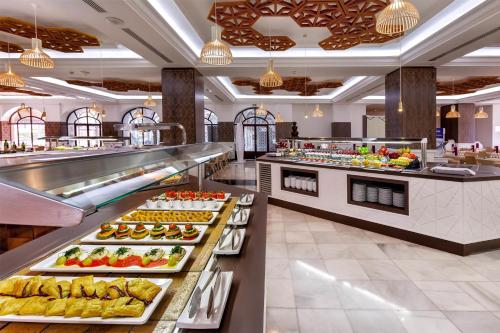 a buffet line with many different types of food at Barceló Isla Canela in Isla Canela
