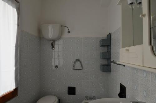 a bathroom with a sink and a toilet in it at Fpo-Rose02p1 in Porto Ottiolu