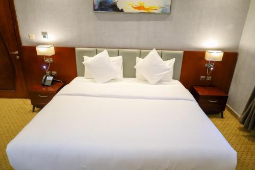 a large white bed in a hotel room at Best Day Hotel and Resorts المحمدية in Jeddah