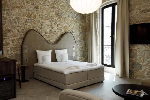 Postel nebo postele na pokoji v ubytování Notre Dame Apart Hotel RENOVATED 2025