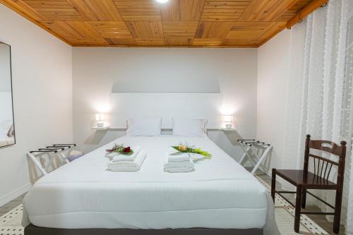 Ένα ή περισσότερα κρεβάτια σε δωμάτιο στο Casa do Ninho