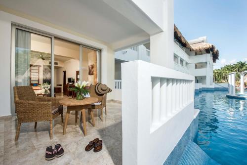 an image of a villa with a swimming pool at Grand Sunset Princess - All Inclusive in Playa del Carmen