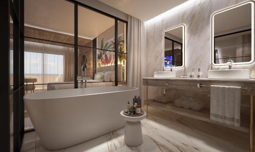 a bathroom with a large tub and two sinks at Grand Sunset Princess - All Inclusive in Playa del Carmen
