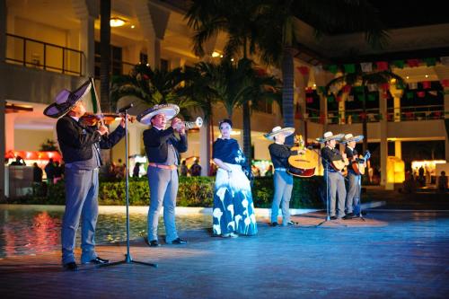 a group of people playing music on a stage at Grand Riviera Princess - All Inclusive in Playa del Carmen