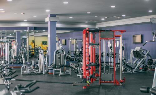 a gym with lots of equipment in a room at Grand Riviera Princess - All Inclusive in Playa del Carmen
