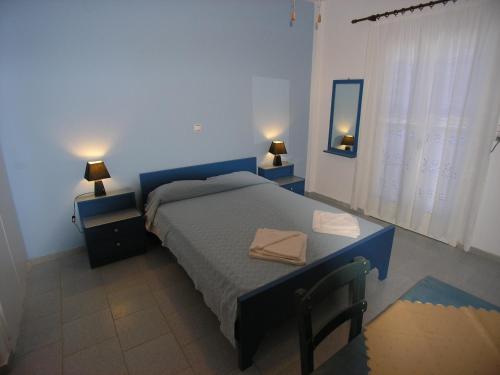 A bed or beds in a room at Studios Panorama Drios