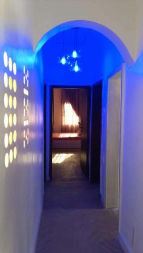 a hallway with blue lights in a room at Citec Estate, Mbora, 5mins to Jabi Lake Mall, Abuja in Abuja