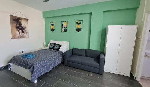 a bedroom with a bed and a chair at Rivera Studios 3 in Limassol