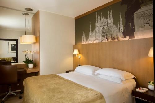 Postel nebo postele na pokoji v ubytování Starhotels Ritz