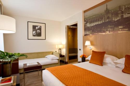 Postel nebo postele na pokoji v ubytování Starhotels Ritz
