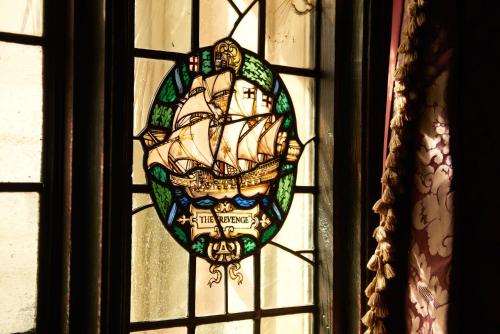 a stained glass window with a ship on it at The Gore London - Starhotels Collezione in London