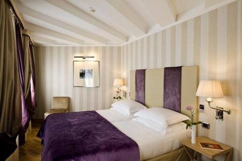 Ένα ή περισσότερα κρεβάτια σε δωμάτιο στο Splendid Venice - Starhotels Collezione