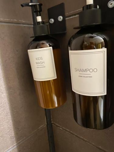 two bottles of wine sitting next to each other at Cheerful house with sauna and bathtub in Almunge
