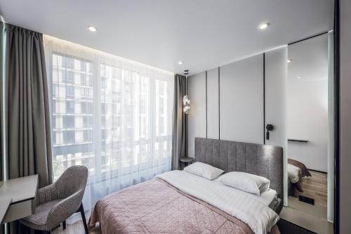 Postel nebo postele na pokoji v ubytování Petrovdom Apartments 5-123, Building 18, in RC Fayna Town, Saliutna Street 2