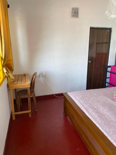 Ein Bett oder Betten in einem Zimmer der Unterkunft Sayuri Beach Hotel