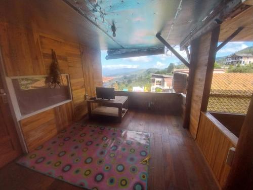 a room with a laptop on a table in a room at Varvara hill in Cigugur