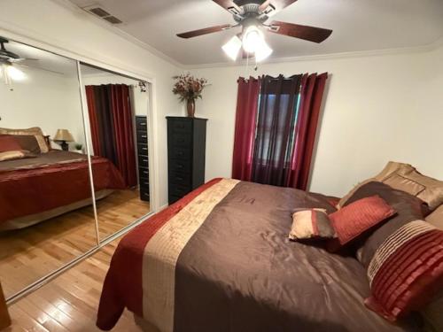 a bedroom with a bed and a ceiling fan at Shuler Farm in Robbinsville