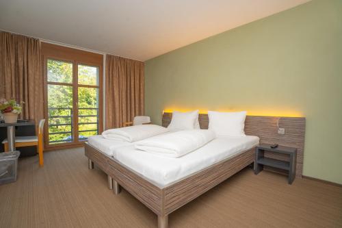 Katil atau katil-katil dalam bilik di Hotel Restaurant Seegarten