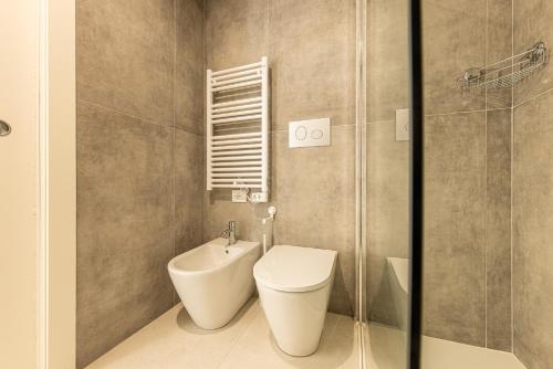 a bathroom with a toilet and a shower at Binda 21-2F charme moderno Navigli - Vesta in Milan