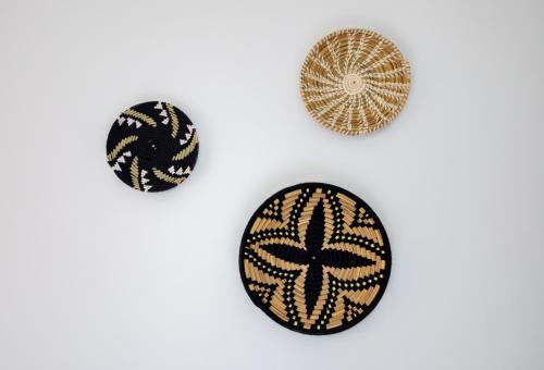 three buttons with black and gold patterns on a white background at Appartement Dar Tamraght in Tamraght Ouzdar