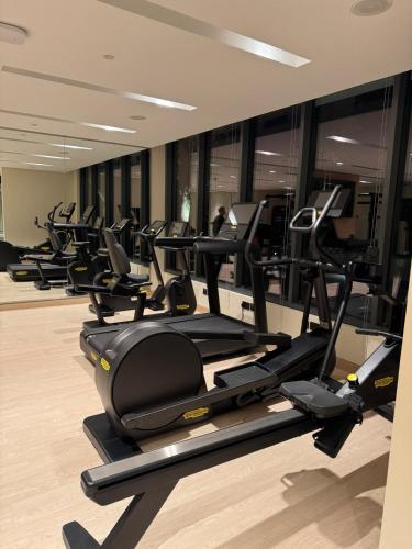 a row of treadmills in a gym at Address Residence Marassi Vista-studio in Amwaj Island