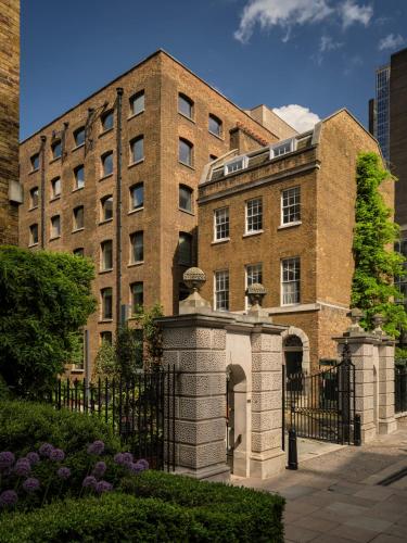 a brick building with a gate in front of it at Sir Devonshire Square Hotel, part of Sircle Collection in London