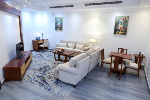 a living room with a couch and a table at Best Day Hotel and Resorts المحمدية in Jeddah