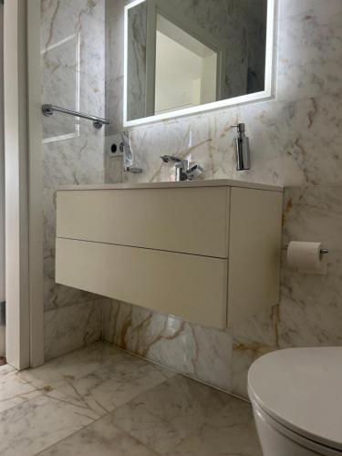 Un baño de Sakalo apartamentai