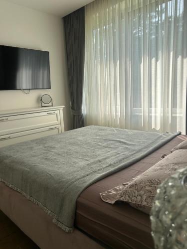 Una cama o camas en una habitación de Sakalo apartamentai