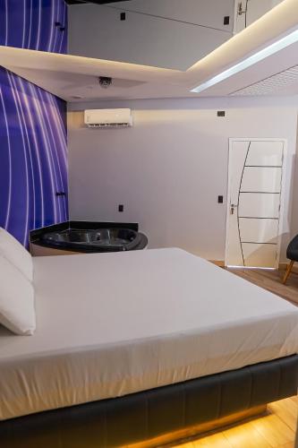 Ένα ή περισσότερα κρεβάτια σε δωμάτιο στο STILLUS - Hotel e Motel