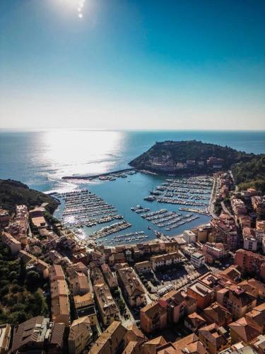 an aerial view of a harbor with boats in the water at Isolotto Guest House in Porto Ercole
