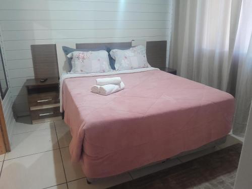 Postel nebo postele na pokoji v ubytování Hospedagem Domiciliar Lar doce Lar