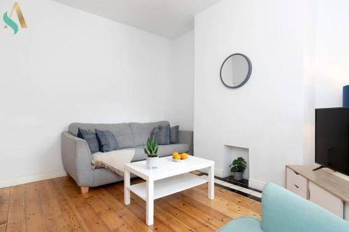 a living room with a couch and a table at Thornaby Road TSAC in Stockton-on-Tees