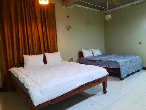 Katil atau katil-katil dalam bilik di Red Road House