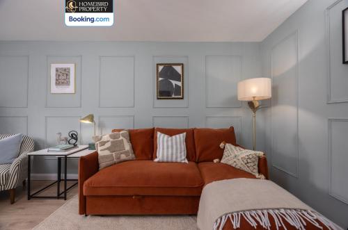 a living room with a couch with pillows on it at Luxuriou 5 Bedroom House By Homebird Property Management Short Lets & Serviced Accommodation Leeds With Private Parking & Free WiFi in Leeds