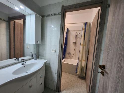 a bathroom with a sink and a shower and a tub at Vico Sant Erasmo Alassio in Alassio