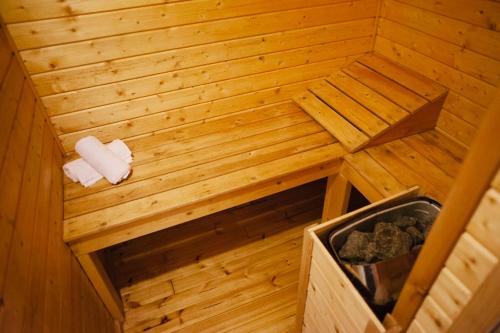 an inside view of a wooden sauna with a box at Ein Zivan Village Resort in Ein Zivan