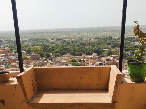 a balcony with a view of a city at Hotel Nomadic Haveli in Jaisalmer