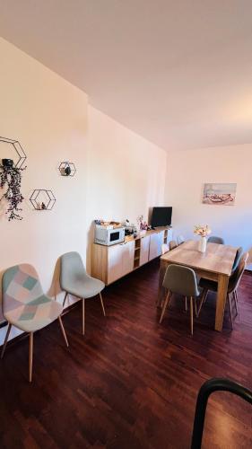 a living room with a table and chairs at Kasa Mondello in Mondello