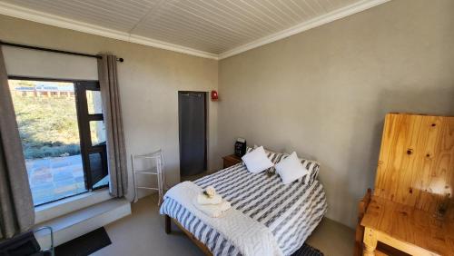 Katil atau katil-katil dalam bilik di Shama Lodge - "Silent Sunsets" Duplex Cottage