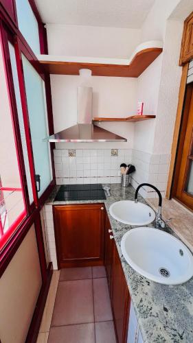 a bathroom with two sinks and a counter top at Kasa Mondello in Mondello