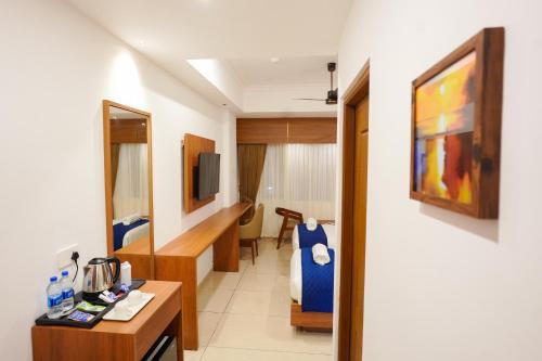 Hotel Praada Residencyにあるベッド