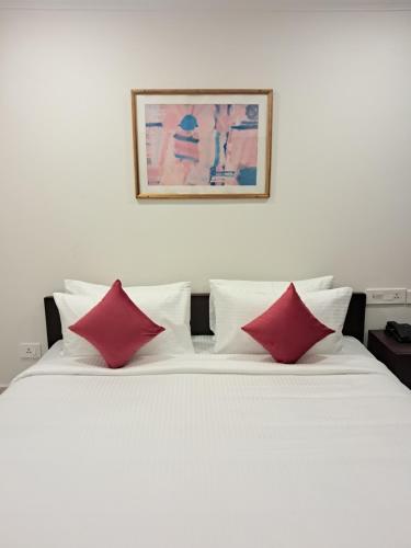 Ένα ή περισσότερα κρεβάτια σε δωμάτιο στο Amber Hotels Nungambakkam