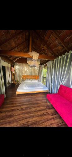 a bedroom with a bed in a tent at KoMleo Farm in Buôn Kô M'lêo