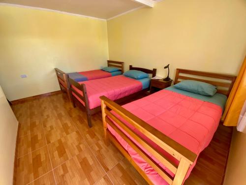 Ένα ή περισσότερα κρεβάτια σε δωμάτιο στο Hostal Travel House