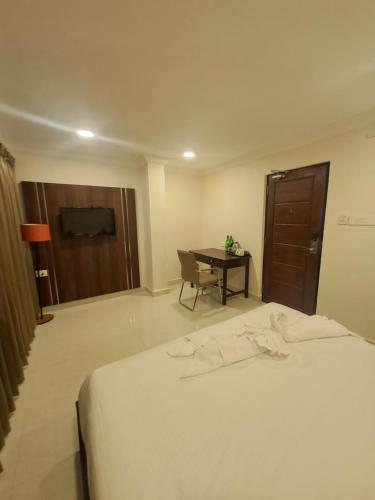 Ένα ή περισσότερα κρεβάτια σε δωμάτιο στο Amber Hotels Nungambakkam