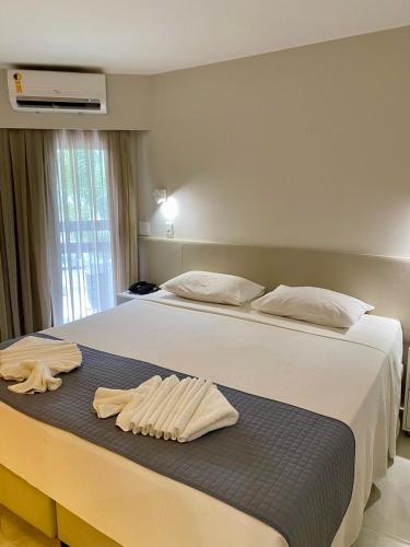 Postel nebo postele na pokoji v ubytování Jatiuca Suítes Resort FLAT